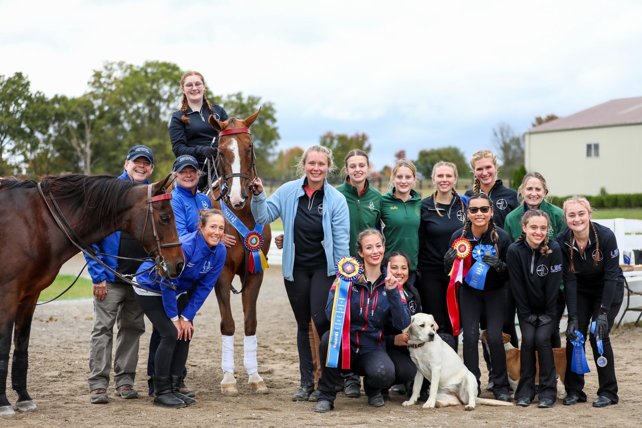 Team members posing for a photo at a show.