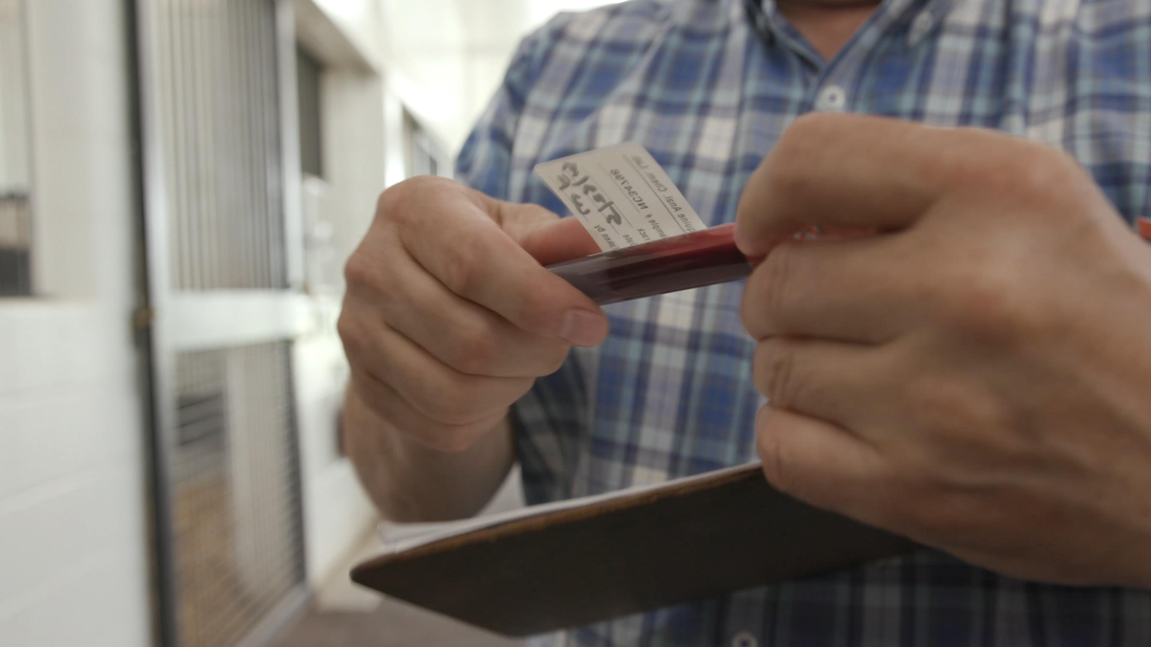 Dr. Stanley holding a sample