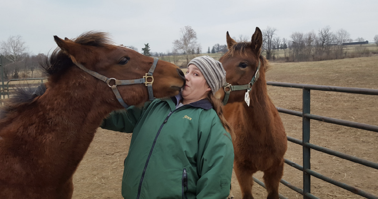 Jennifer Cain with two horses